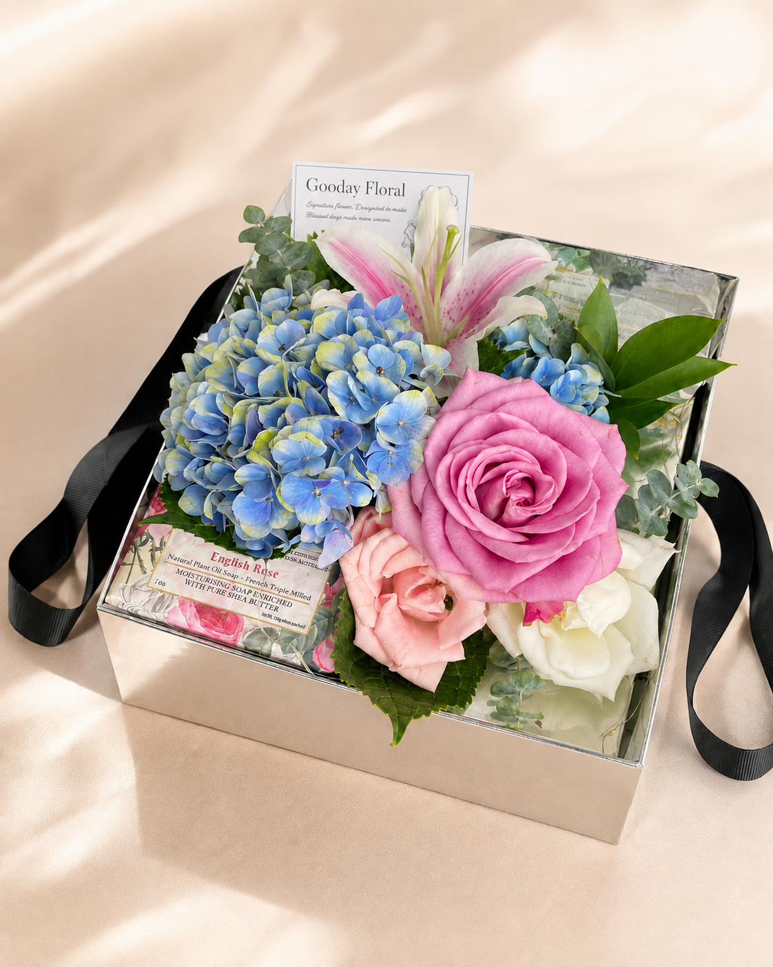 Pastel blue and pink flower box with hydrangea and roses