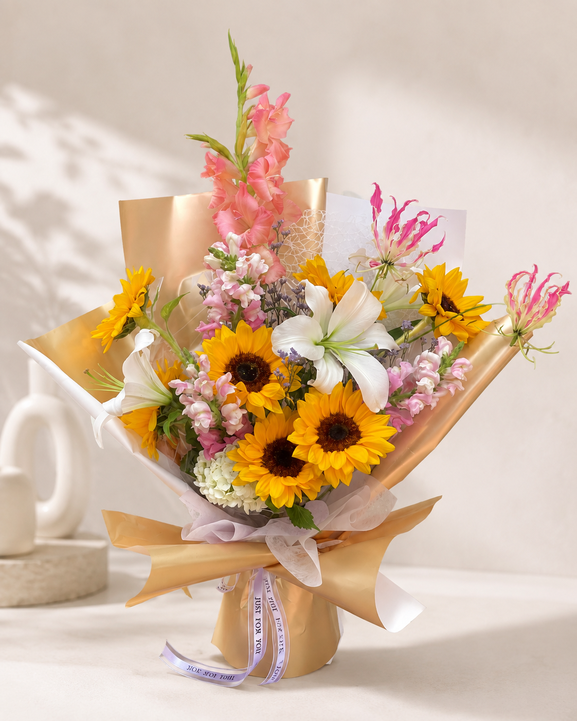 Bright yellow pink and white seasonal flower bouquet with sunflowers