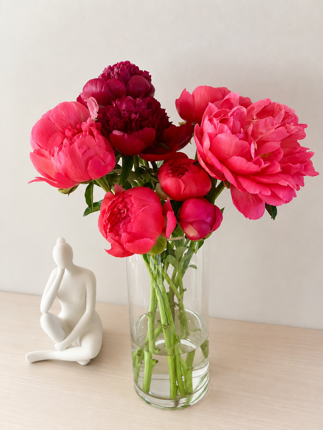 Pink seasonal flowers arranged in a vase at home in Auckland